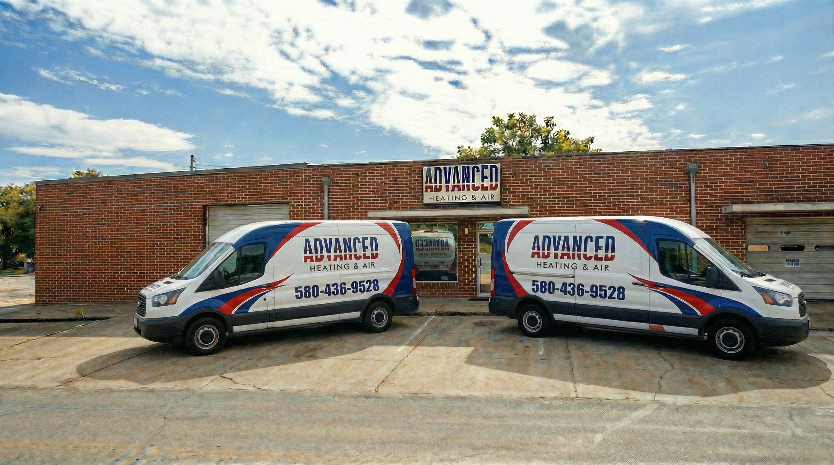 Advanced Heating & Air storefront and service vans